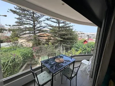 a table and chairs on a balcony with a view at SUPERBE STUDIO MEUBLE CASABLANCA in Casablanca