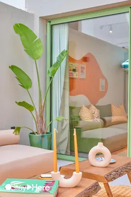 a living room with a table with two candles on it at Stayhere Casablanca - CFC - Vibrant Residence in Casablanca
