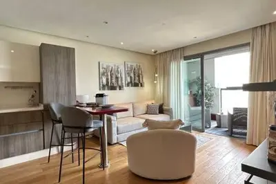 a living room with a couch and a table and chairs at Marina Urban Sea View - By AppartAli in Casablanca