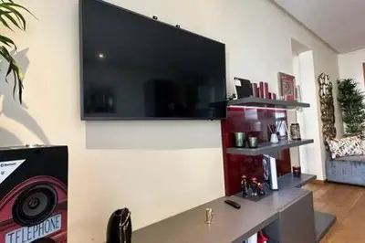 a living room with a flat screen tv on a wall at Marina Urban Sea View - By AppartAli in Casablanca