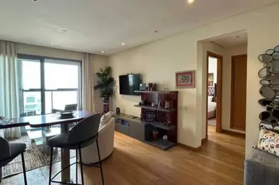 a living room with a table and a dining room at Marina Urban Sea View - By AppartAli in Casablanca