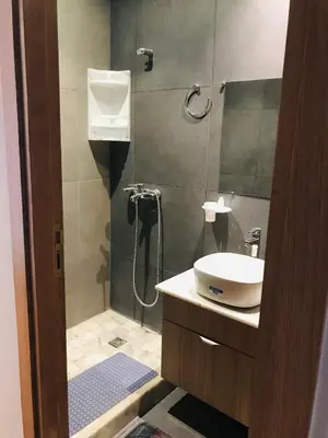 a bathroom with a shower and a sink at THE luxurious and romantic pearl apartment in Mohammedia
