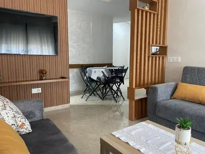 a living room with a couch and a table at Studio meublé neuf à louer in Casablanca