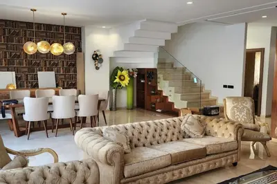 a living room with a couch and a dining room at Villa Jack Beach in Tamaris