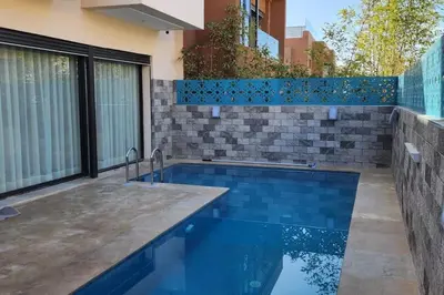 a swimming pool in the backyard of a house at Villa Jack Beach in Tamaris