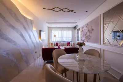 a dining room with a table and chairs at Chez Joe - Location journalière Casablanca in Casablanca