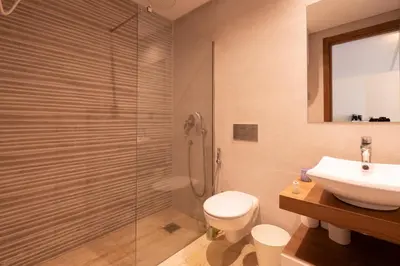 a bathroom with a shower and a toilet and a sink at Chez Joe - Location journalière Casablanca in Casablanca