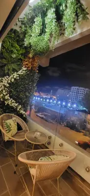a room with chairs and tables and a large window at Chez Joe - Location journalière Casablanca in Casablanca