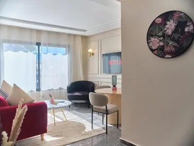 a living room with a couch and a table at TheCasaEdition Gauthier Residency City Center in Casablanca