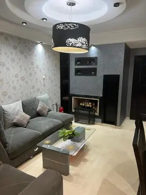 a living room with a couch and a fire place at Luxury apartments 3 in Casablanca