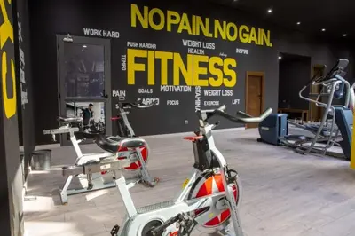 a gym with several exercise bikes in a room at Appartement - Dar Bouazza spacieux avec piscine à Dar Bouazza in Dar Bouazza