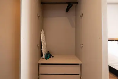 a room with a closet with a desk and a bed at TWENTY SIX ANFA LUXURY RESIDENCE by Shortstaymaroc -Hyper Centre -Parking in Casablanca
