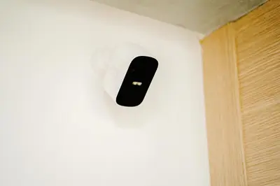 a black remote control on a white wall at Best location, 2 minute to beach in Casablanca