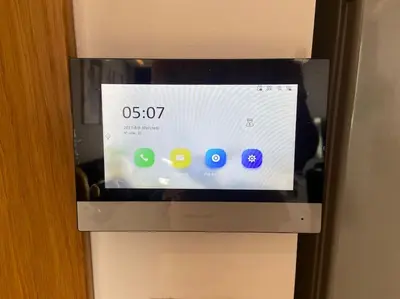 a television in a refrigerator with a clock on it at Corniche Casablanca - Black New in Casablanca