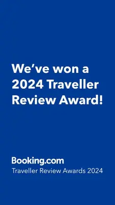 a blue sign that says weve won a traveler review award at Maison du bonheur in El Harhoura