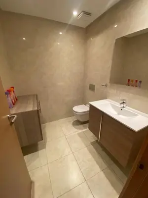a bathroom with a sink and a toilet at Prestigia Appartement Luxueux in Rabat