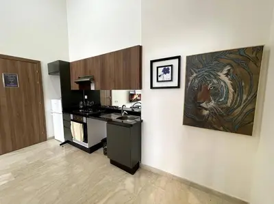 a kitchen with a sink and a stove in it at Luxury apartment 5 minutes Casablanca Airport in Nouaceur