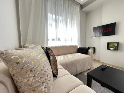 a living room with a couch and a table at Comfy & Modern Studio at blv Anfa in Casablanca