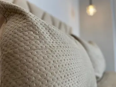 a close up of a white pillow on a bed at Comfy & Modern Studio at blv Anfa in Casablanca