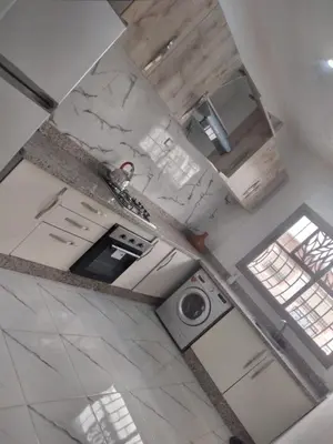 an overhead view of a kitchen with a washing machine at Sweet Room Airport 5 in Deroua