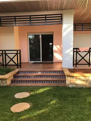 a front porch of a house with a patio at BOUZNIKA BAY COUNTRY CLUB in Bouznika