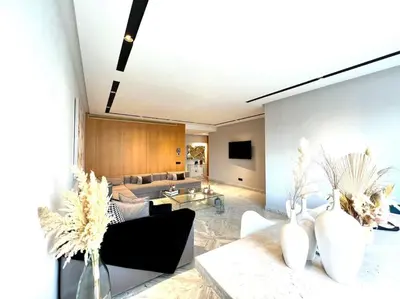 a living room with a couch and a table at Eden Luxury Anfa-Big Apt 3 Bedrooms/Massira Avenue in Casablanca