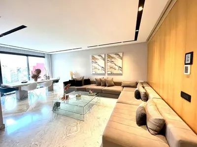 a large living room with a couch and a table at Eden Luxury Anfa-Big Apt 3 Bedrooms/Massira Avenue in Casablanca