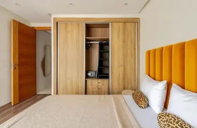 a bedroom with a large bed and a closet at Atlantic Suite View 1 in Casablanca