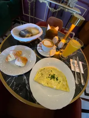 a table with plates of breakfast food on it at Atlantic Suite View 1 in Casablanca