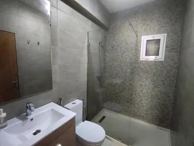 a bathroom with a toilet and a sink and a shower at rabatapartmentresidence in Rabat