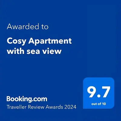 a blue screen with the text awarded to cosy appointment with sea view at Cosy Apartment with sea view in Sidi Rahal