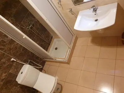 a bathroom with a toilet and a sink at Mosquée & Foire by Saloua in Casablanca