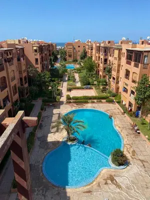 an overhead view of a swimming pool in a building at Appartement mohamedia Ricoflores vue sur piscine in Mohammedia