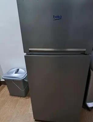 a black refrigerator and a trash can in a room at Joli Studio au Centre Ville avec WIFI - Netflix in Casablanca
