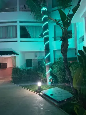 a building with a light on the side of it at night at lovely 2 bedroom vacation home with pool/beach in Skhirat