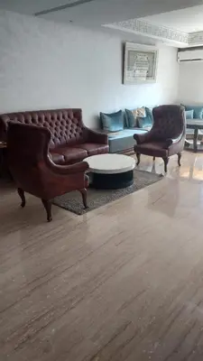 a living room with a couch and two chairs at Casa Fainna in Casablanca