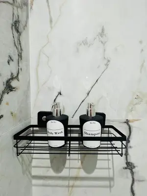 two complimentary candles on a shelf in a bathroom at Appartement en bord de mer in Pont Blondin