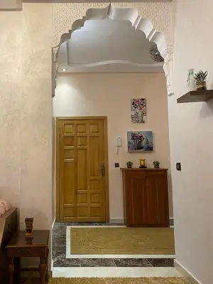 a hallway with a wooden door in a building at Luxurious Holiday Home in Temara