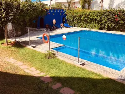 a swimming pool with a fence around it at Hébergement bord de mer in Casablanca