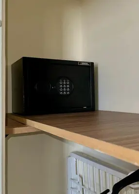 a microwave sitting on a shelf in a kitchen at sea view appart and roof top, jack beach Tamaris, Dar Bouaza in Casablanca