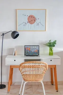 a desk with a laptop and a chair at Luxury 3 Bedroom Apartment in the Heart of Agdal by MasterHost in Rabat