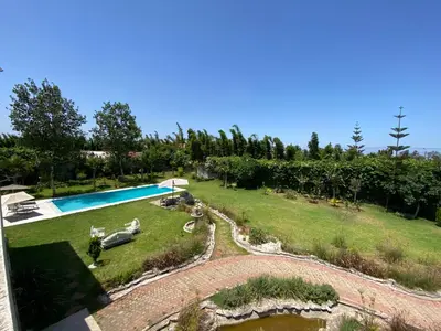an aerial view of a garden with a swimming pool at Villa in Rabat in Oulad Mbark
