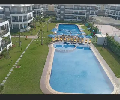 an overhead view of a swimming pool in a building at Amwaj Beach Sidi Rahal in Casablanca