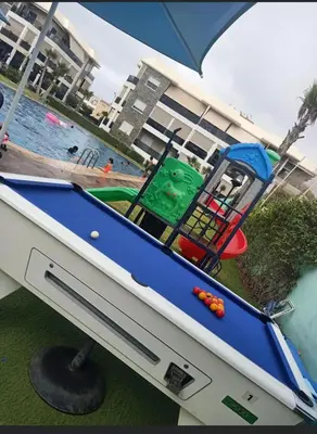 a toy pool table and a playset in a boat at Amwaj Beach Sidi Rahal in Casablanca
