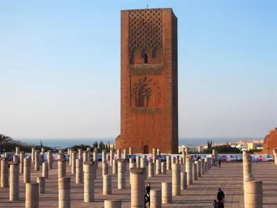 a tall brick tower with a bunch of poles in front of it at Sotto ma carino in Temara