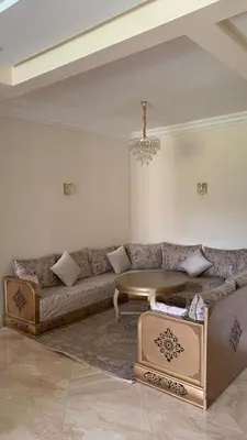 a living room with a couch and a table at Residence Casa Bay Sidi Rahal in Sidi Rahal