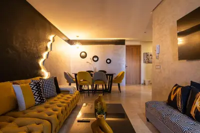 a living room with a couch and a table at La terrasse d'Audrey - Short stay au coeur du Maarif in Casablanca