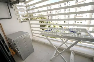 a table in front of a large window with a table at Luxury Prestigia 2Bed Rooms in Rabat