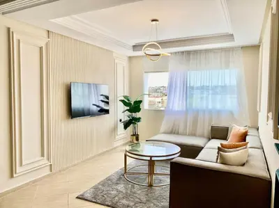 a living room with a couch and a table at Appartement au cœur de Rabat in Rabat