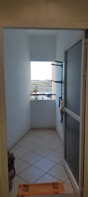an empty kitchen with a refrigerator and a window at APPARTEMENT haut standing in O Ben Slimane